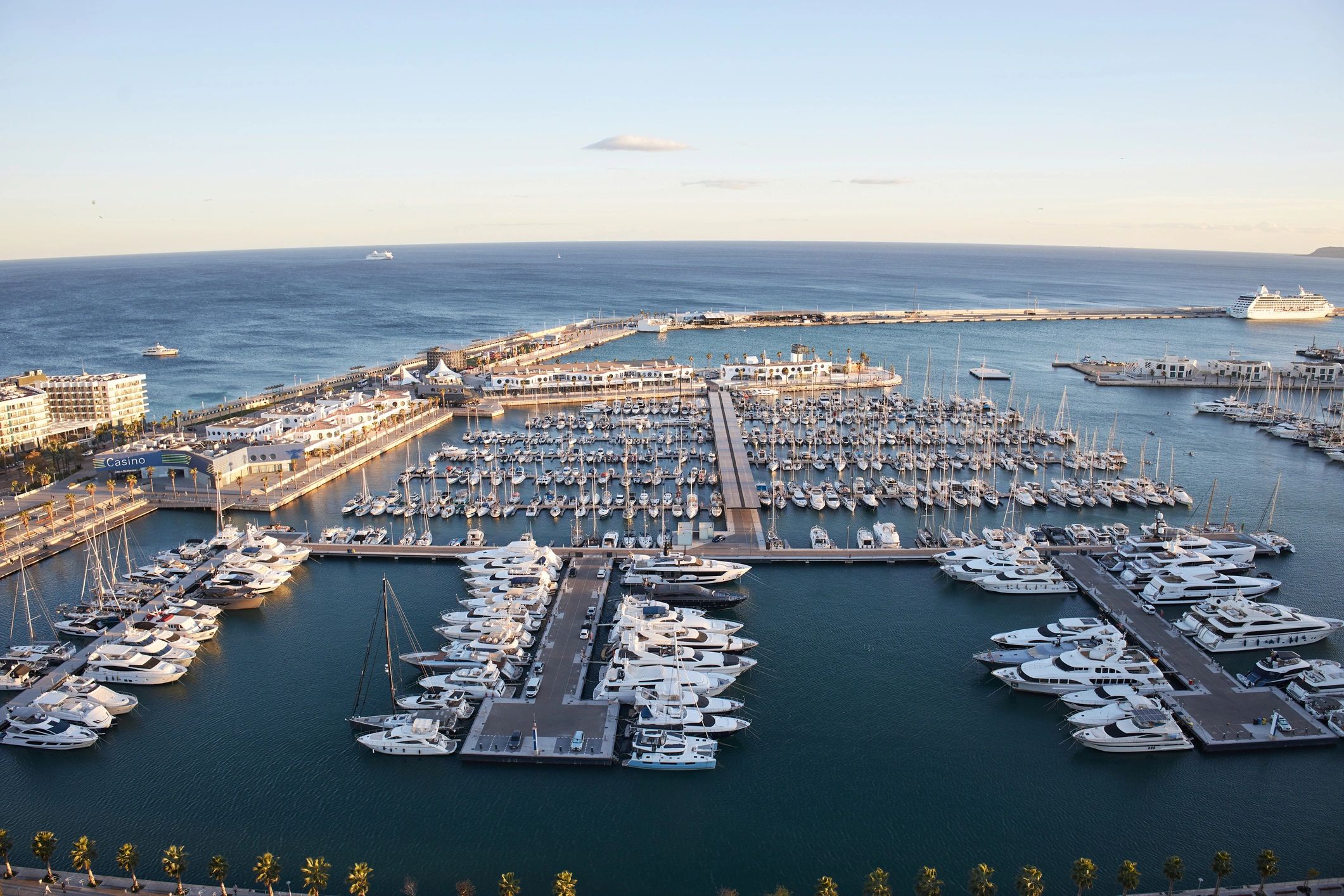 Marina with yachts docked in calm water